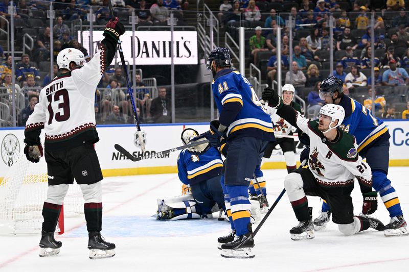 Sep 23, 2023; St. Louis, Missouri, USA; Arizona Coyotes forward Nathan Smith (13) reacts after a goal by forward Miloa Kelemen (21) against the St. Louis Blues during the third period at Enterprise Center. Mandatory Credit: Jeff Le-USA TODAY Sports