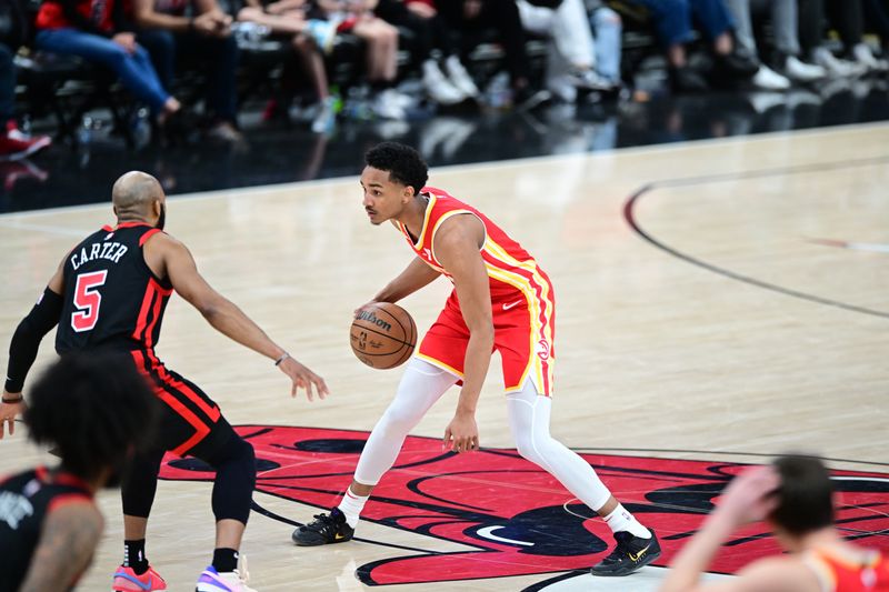 CHICAGO, IL - APRIL 1: Kobe Bufkin #4 of the Atlanta Hawks dribbles the ball during the game against the Chicago Bulls on April 1, 2024 at United Center in Chicago, Illinois. NOTE TO USER: User expressly acknowledges and agrees that, by downloading and or using this photograph, User is consenting to the terms and conditions of the Getty Images License Agreement. Mandatory Copyright Notice: Copyright 2024 NBAE (Photo by Adam Hagy/NBAE via Getty Images)