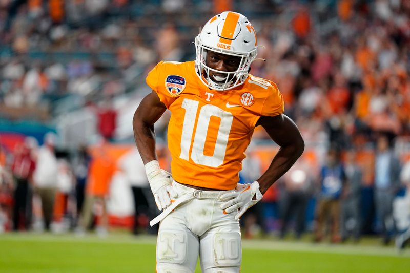 Dec 30, 2022; Miami Gardens, FL, USA; Tennessee Volunteers wide receiver Squirrel White (10) celebrates after catching a touchdown pass against the Clemson Tigers during the second half of the 2022 Orange Bowl at Hard Rock Stadium. Mandatory Credit: Rich Storry-USA TODAY Sports