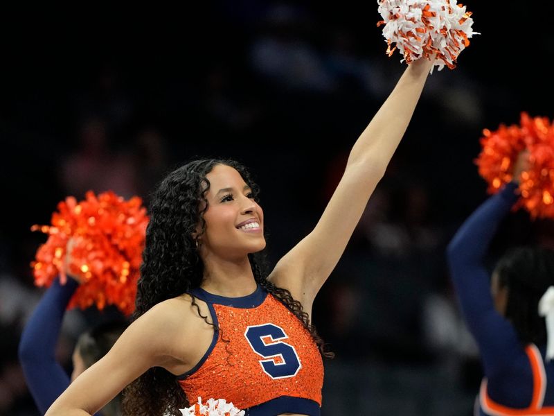 Mar 11, 2025; Charlotte, NC, USA; Syracuse Orange cheerleader performs in the second half at Spectrum Center. Mandatory Credit: Bob Donnan-Imagn Images