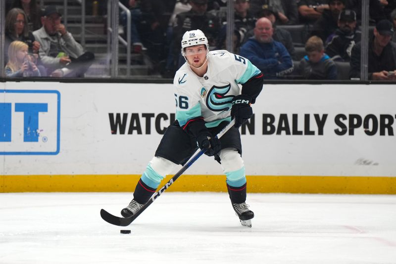 Dec 20, 2023; Los Angeles, California, USA; Seattle Kraken right wing Kailer Yamamoto (56) passes the puck against the LA Kings in the second period at Crypto.com Arena. Mandatory Credit: Kirby Lee-USA TODAY Sports