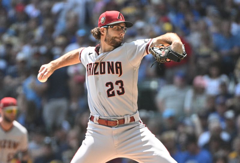 Jun 21, 2023; Milwaukee, Wisconsin, USA; Arizona Diamondbacks starting pitcher Zac Gallen (23) delivers a pitch against the Milwaukee Brewers in the first inning at American Family Field. Mandatory Credit: Michael McLoone-USA TODAY Sports