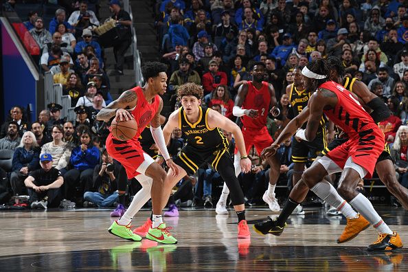 SAN FRANCISCO, CA - DECEMBER 23: Brandin Podziemski #2 of the Golden State Warriors plays defense during the game against the Portland Trail Blazers on December 23, 2023 at Chase Center in San Francisco, California. NOTE TO USER: User expressly acknowledges and agrees that, by downloading and or using this photograph, user is consenting to the terms and conditions of Getty Images License Agreement. Mandatory Copyright Notice: Copyright 2023 NBAE (Photo by Noah Graham/NBAE via Getty Images)