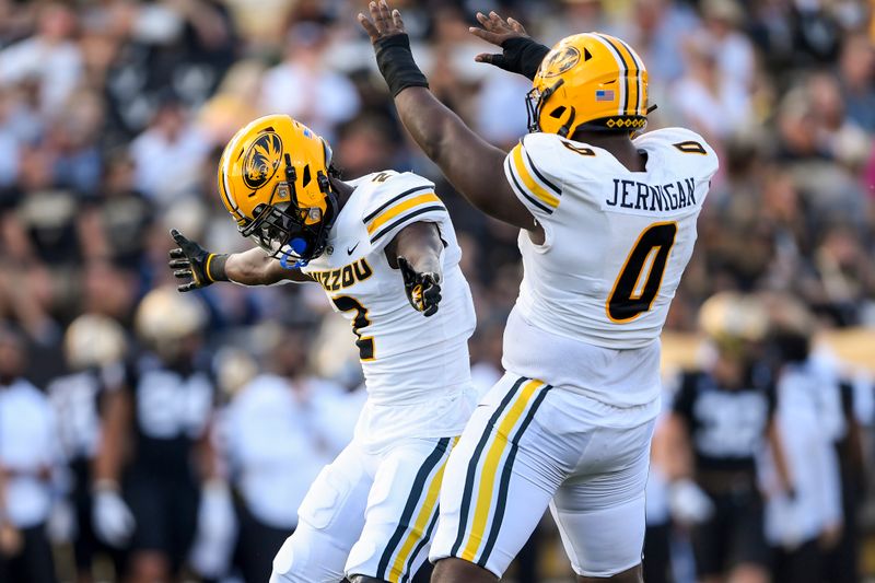 Sep 30, 2023; Nashville, Tennessee, USA; Missouri Tigers safety Ennis Rakestraw Jr. (2) and defensive lineman Jayden Jernigan (0) celebrate Rakestraw Jr.   s tackle for a loss of Vanderbilt Commodores tight end Justin Ball (84) during the first half at FirstBank Stadium. Mandatory Credit: Steve Roberts-USA TODAY Sports