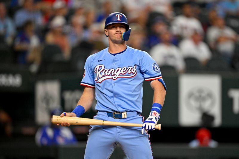 Aug 24, 2025; Arlington, Texas, USA; Texas Rangers third baseman Josh Jung (6) reacts to striking out during the second inning against the Cleveland Guardians at Globe Life Field. Mandatory Credit: Jerome Miron-Imagn Images