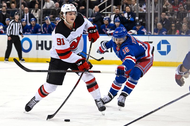 Dec 2, 2024; New York, New York, USA;  New Jersey Devils center Dawson Mercer (91) shoots as New York Rangers center Vincent Trocheck (16) defends during the first period  at Madison Square Garden. Mandatory Credit: Dennis Schneidler-Imagn Images