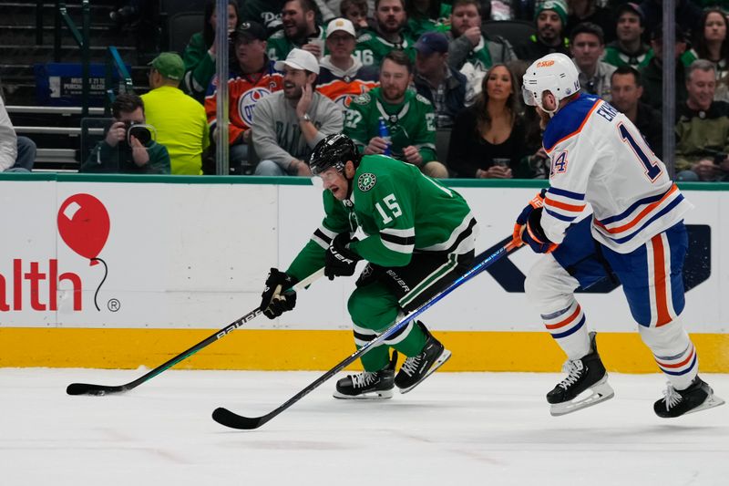 Feb 17, 2024; Dallas, Texas, USA;  Dallas Stars center Craig Smith (15) skates with the puck against Edmonton Oilers defenseman Mattias Ekholm (14) during the second period at American Airlines Center. Mandatory Credit: Chris Jones-USA TODAY Sports