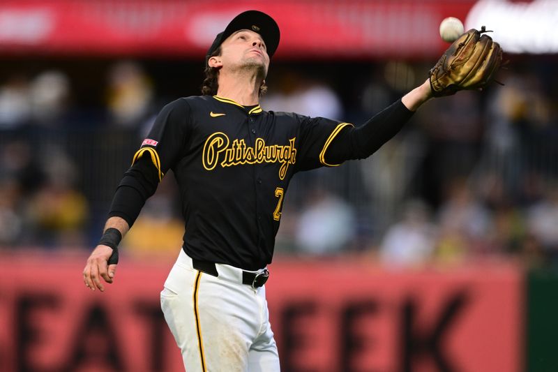 May 3, 2025; Pittsburgh, Pennsylvania, USA; Pittsburgh Pirates second baseman Adam Frazier (26) catches a ball during the sixth inning against the San Diego Padres at PNC Park. Mandatory Credit: David Dermer-Imagn Images