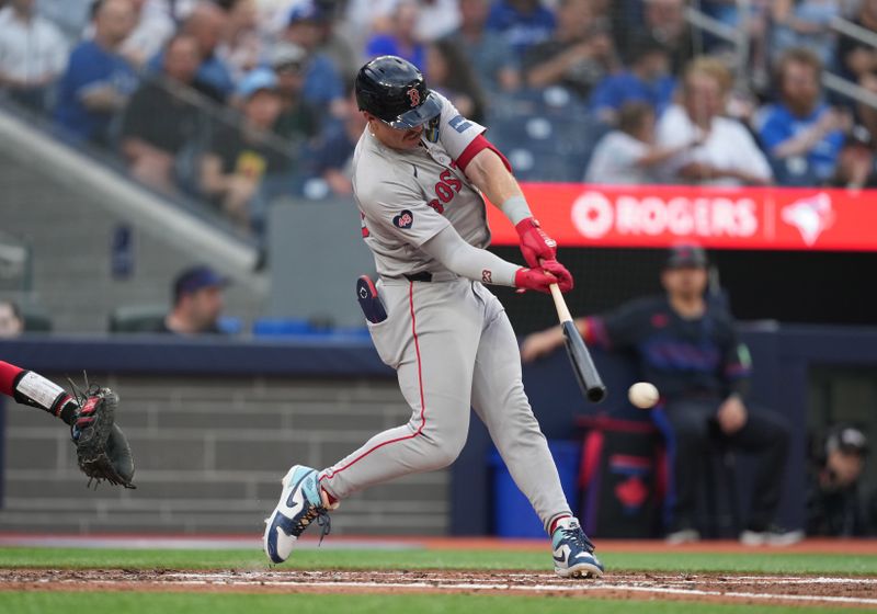 Jun 19, 2024; Toronto, Ontario, CAN; Boston Red Sox center fielder Romy Gonzalez (23) gets on base on an error against the Toronto Blue Jays during the third inning at Rogers Centre. Mandatory Credit: Nick Turchiaro-USA TODAY Sports