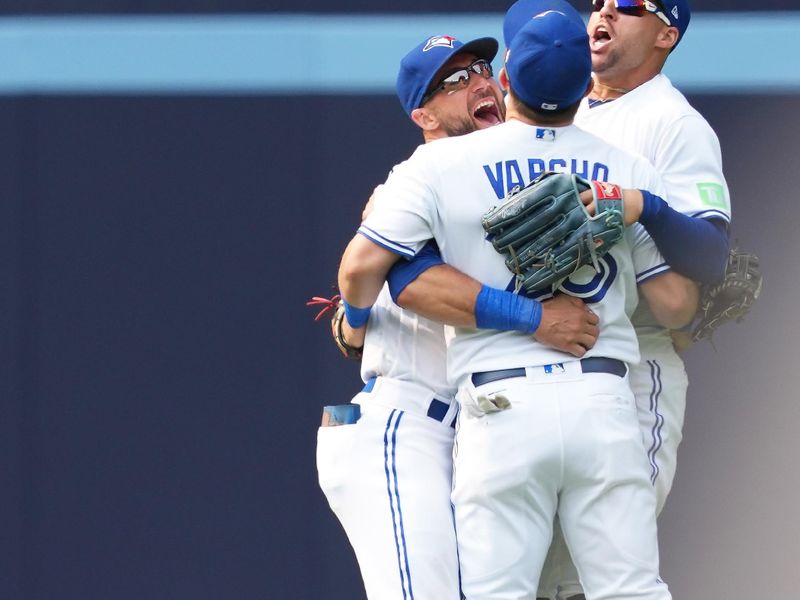 Jul 16, 2023; Toronto, Ontario, CAN; Toronto Blue Jays center fielder Kevin Kiermaier (39) and pinch hitter Daulton Varsho (25) and right fielder George Springer (4) celebrate the win at the end of the ninth inning against the Arizona Diamondbacks at Rogers Centre. Mandatory Credit: Nick Turchiaro-USA TODAY Sports