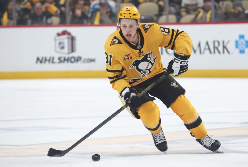 Nov 22, 2025; Pittsburgh, Pennsylvania, USA;  Pittsburgh Penguins center Ben Kindel (81) skates with the puck against the Seattle Kraken during the first period at PPG Paints Arena. Mandatory Credit: Charles LeClaire-Imagn Images