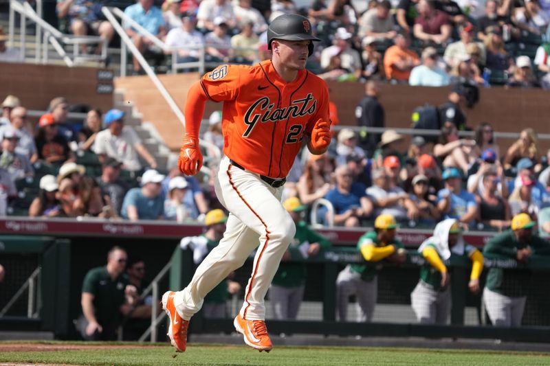 Feb 23, 2026; Scottsdale, Arizona, USA; San Francisco Giants third baseman Matt Chapman (26) runs to first against the Athletics in the second inning at Scottsdale Stadium. Mandatory Credit: Rick Scuteri-Imagn Images