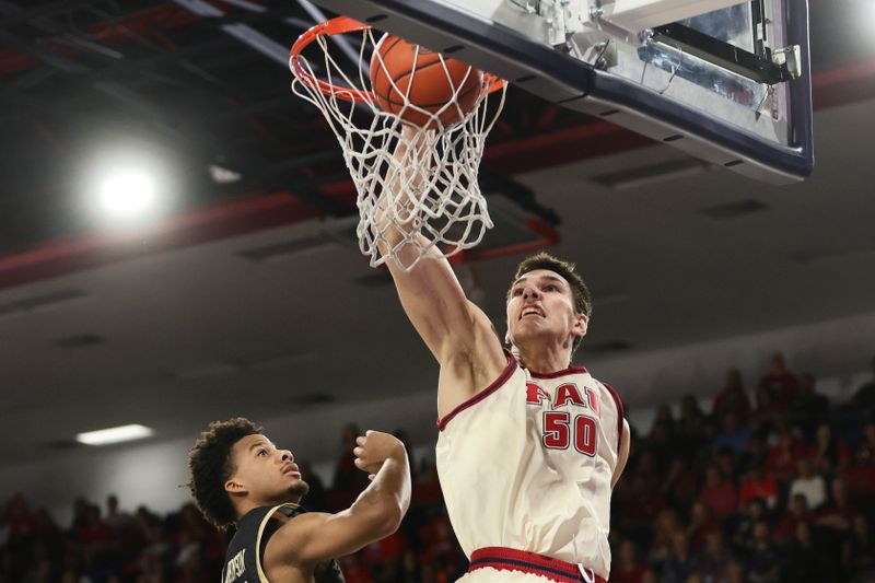 Jan 14, 2024; Boca Raton, Florida, USA; Florida Atlantic Owls center Vladislav Goldin (50) dunks the basketball against the UAB Blazers during the second half at Eleanor R. Baldwin Arena. Mandatory Credit: Sam Navarro-USA TODAY Sports