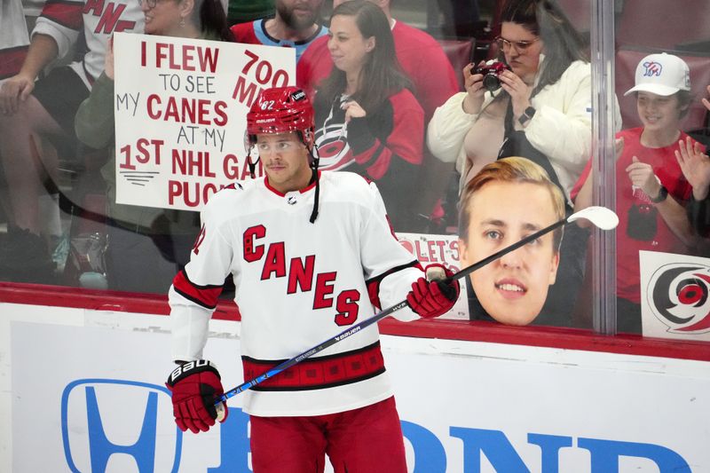 Nov 10, 2023; Sunrise, Florida, USA; Carolina Hurricanes center Jesperi Kotkaniemi (82) stands on the ice prior to the game against the Florida Panthers at Amerant Bank Arena. Mandatory Credit: Jasen Vinlove-USA TODAY Sports