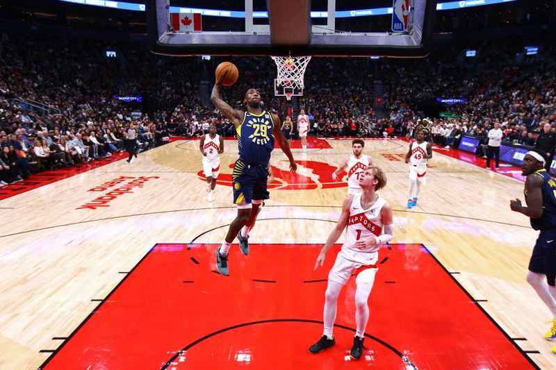 TORONTO, CANADA - NOVEMBER 18: Quenton Jackson #29 of the Indiana Pacers dunks the ball during the game against the Toronto Raptors on November 18, 2024 at the Scotiabank Arena in Toronto, Ontario, Canada.  NOTE TO USER: User expressly acknowledges and agrees that, by downloading and or using this Photograph, user is consenting to the terms and conditions of the Getty Images License Agreement.  Mandatory Copyright Notice: Copyright 2024 NBAE (Photo by Vaughn Ridley/NBAE via Getty Images)