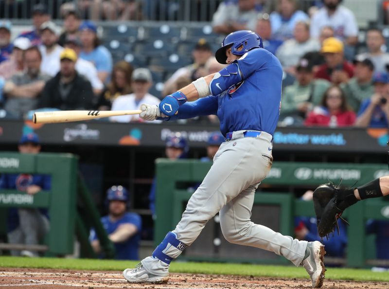 Apr 29, 2025; Pittsburgh, Pennsylvania, USA;  Chicago Cubs catcher Carson Kelly (15) hits a two-run home run against the Pittsburgh Pirates during the fourth inning at PNC Park. Mandatory Credit: Charles LeClaire-Imagn Images