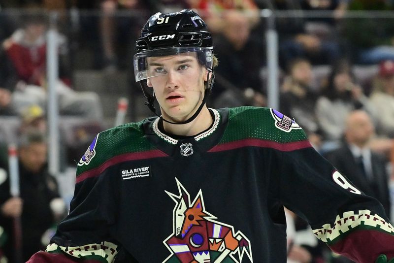 Apr 3, 2024; Tempe, Arizona, USA; Arizona Coyotes right wing Josh Doan (91) looks on in the second period against the Vancouver Canucks
 at Mullett Arena. Mandatory Credit: Matt Kartozian-USA TODAY Sports