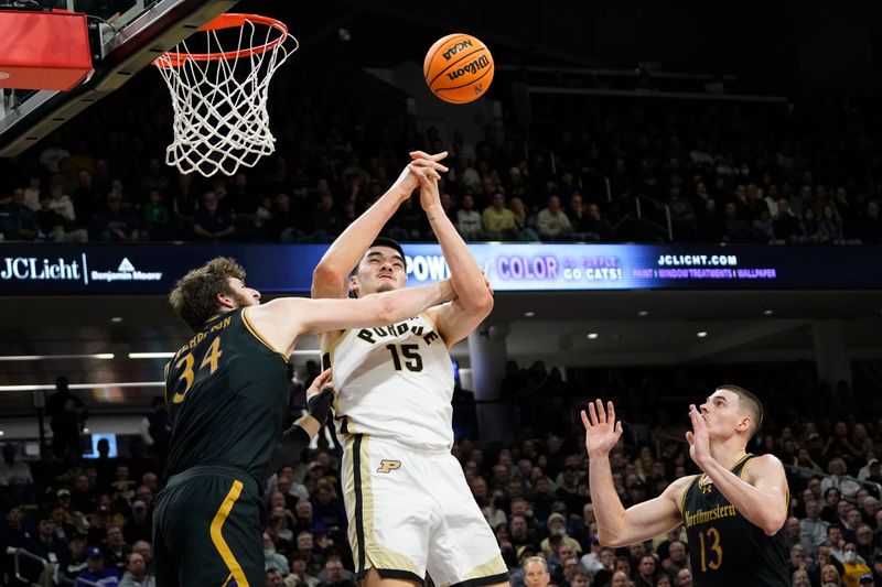 Dec 1, 2023; Evanston, Illinois, USA; Northwestern Wildcats center Matthew Nicholson (34) fouls Purdue Boilermakers center Zach Edey (15) during the first half at Welsh-Ryan Arena. Mandatory Credit: David Banks-USA TODAY Sports