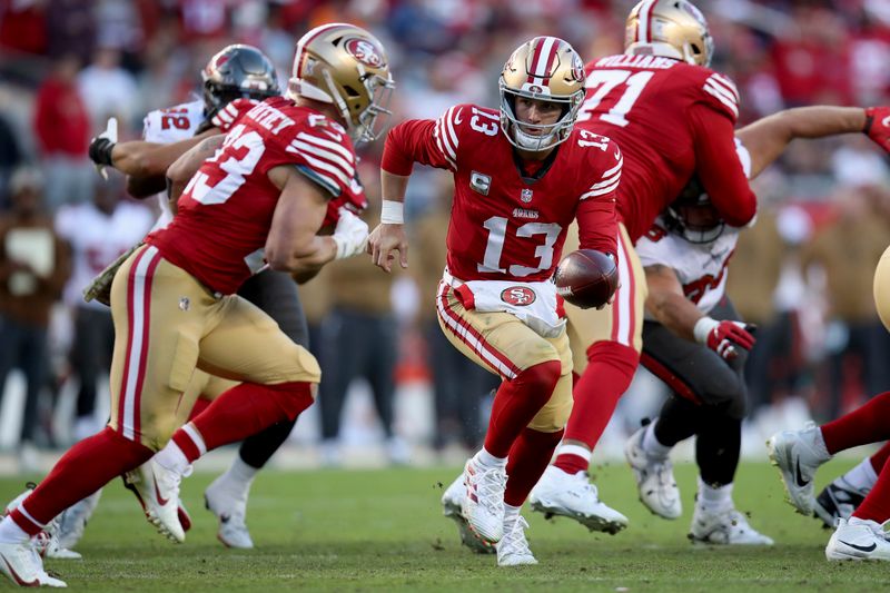 San Francisco 49ers quarterback Brock Purdy (13) runs a play during an NFL football game against the Tampa Bay Buccaneers, Sunday, Nov. 19, 2023, in Santa Clara, Calif. (AP Photo/Scot Tucker)