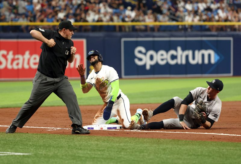 May 10, 2024; St. Petersburg, Florida, USA;  New York Yankees third base Jon Berti (19) tags lout Tampa Bay Rays shortstop José Caballero (7) as he attempted to steal second base during the third inning at Tropicana Field. Mandatory Credit: Kim Klement Neitzel-USA TODAY Sports