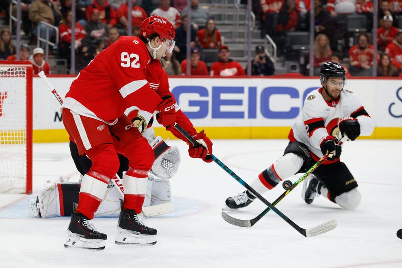 Mar 24, 2026; Detroit, Michigan, USA;  Detroit Red Wings center Marco Kasper (92) tries to deflect the puck in the second period against the Ottawa Senators at Little Caesars Arena. Mandatory Credit: Rick Osentoski-Imagn Images