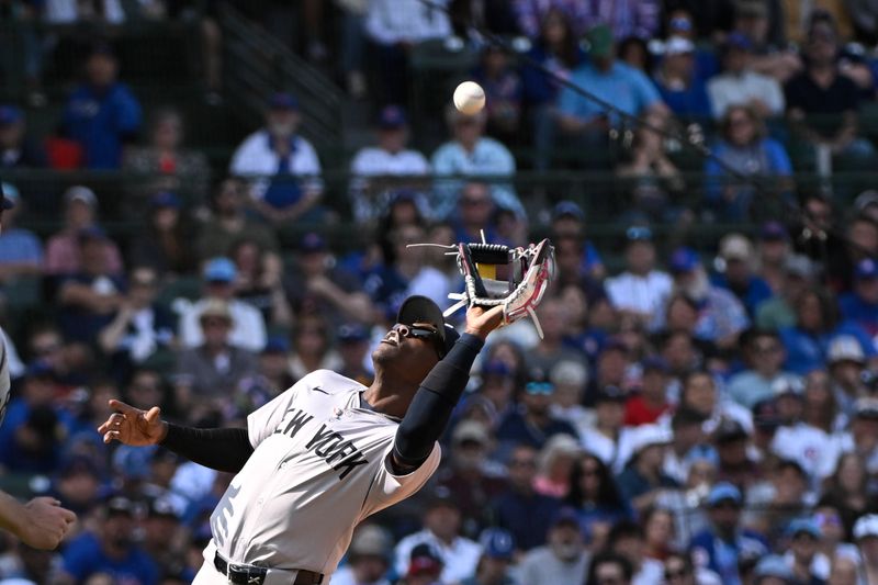 Sep 8, 2024; Chicago, Illinois, USA;  New York Yankees third baseman Jazz Chisholm Jr. (13) catches a fly ball hit by Chicago Cubs outfielder Cody Bellinger (not pictured) during the sixth inning at Wrigley Field. Mandatory Credit: Matt Marton-Imagn Images