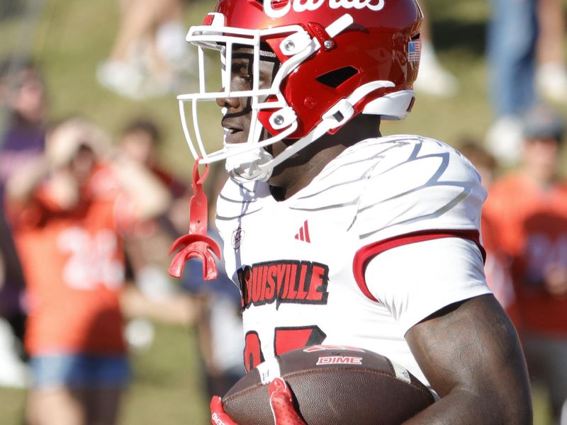 Oct 12, 2024; Charlottesville, Virginia, USA; Louisville Cardinals running back Isaac Brown (25) celebrates after scoring a touchdown against the Virginia Cavaliers during the first half at Scott Stadium. Mandatory Credit: Amber Searls-Imagn Images