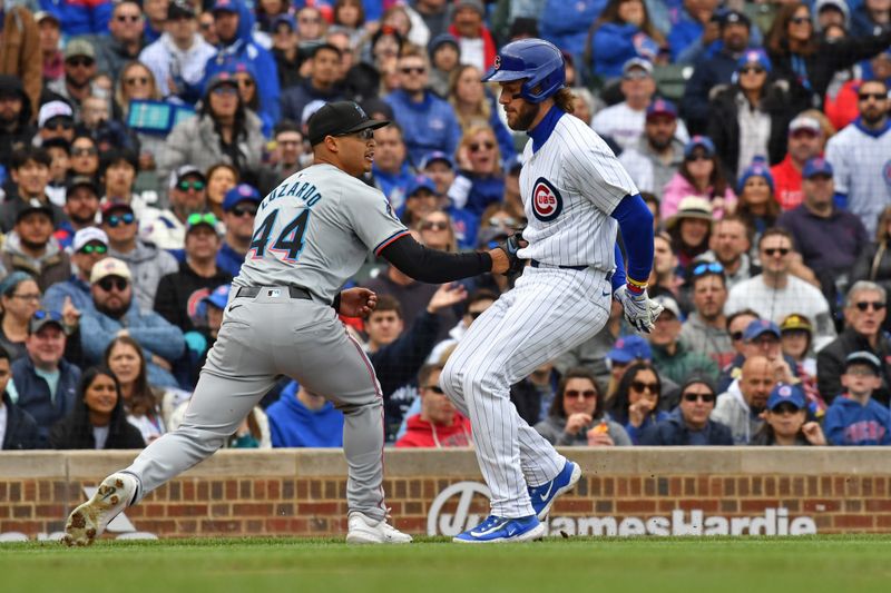 Apr 20, 2024; Chicago, Illinois, USA; Miami Marlins starting pitcher Jesús Luzardo (44) tags out Chicago Cubs right fielder Patrick Wisdom (16) on a fielder’s choice during the third inning at Wrigley Field. Mandatory Credit: Patrick Gorski-USA TODAY Sports