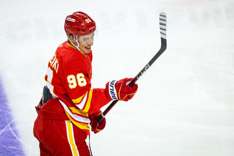 Oct 4, 2024; Calgary, Alberta, CAN; Calgary Flames left wing Andrei Kuzmenko (96) skates during the warmup period against the Winnipeg Jets at Scotiabank Saddledome. Mandatory Credit: Sergei Belski-Imagn Images