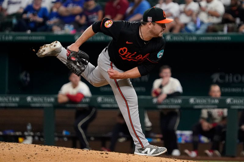 Jul 19, 2024; Arlington, Texas, USA; Baltimore Orioles pitcher Keegan Akin (45) follows through on the his pitch during the eighth inning against the Texas Rangers at Globe Life Field. Mandatory Credit: Raymond Carlin III-USA TODAY Sports