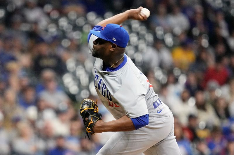 May 28, 2024; Milwaukee, Wisconsin, USA;  Chicago Cubs pitcher Hector Neris (51) throws a pitch during the ninth inning against the Milwaukee Brewers at American Family Field. Mandatory Credit: Jeff Hanisch-USA TODAY Sports