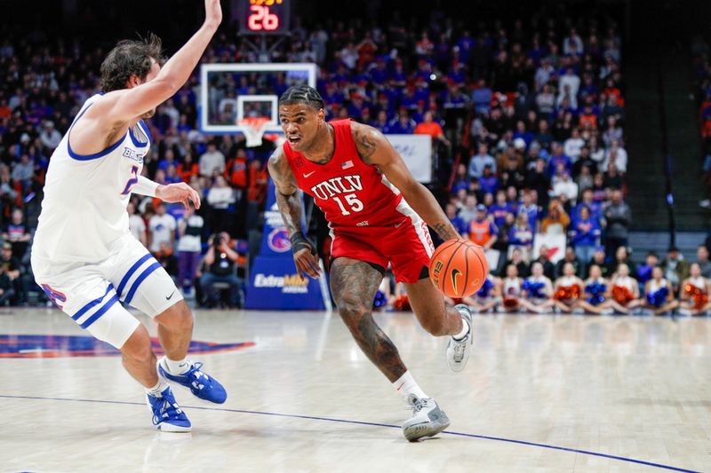 Jan 16, 2024; Boise, Idaho, USA; UNLV Rebels guard Luis Rodriguez (15) works against Boise State Broncos forward Tyson Degenhart (2) during the first half at ExtraMile Arena. Mandatory Credit: Brian Losness-USA TODAY Sports

