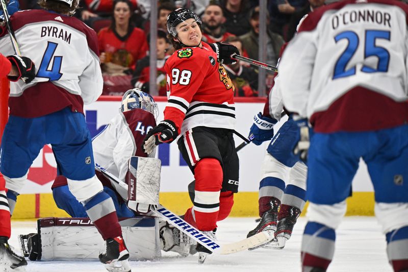 Dec 19, 2023; Chicago, Illinois, USA; Chicago Blackhawks forward Connor Bedard (98) avoids colliding with Colorado Avalanche goaltender Alexandar Georgiev (40) in the third period at United Center. Mandatory Credit: Jamie Sabau-USA TODAY Sports