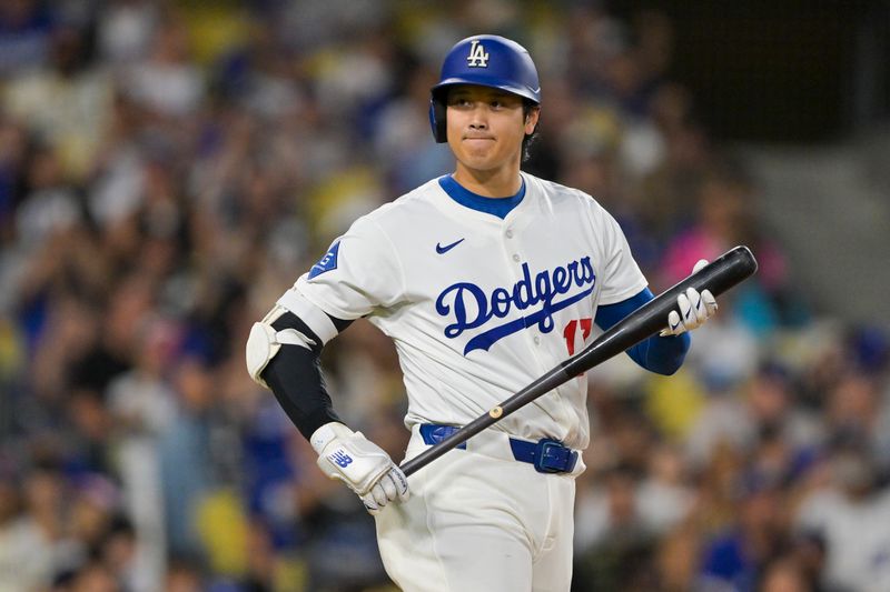 Sep 10, 2025; Los Angeles, California, USA; Los Angeles Dodgers designated hitter Shohei Ohtani (17) looks on during the first inning against the Colorado Rockies at Dodger Stadium. Mandatory Credit: Jayne Kamin-Oncea-Imagn Images