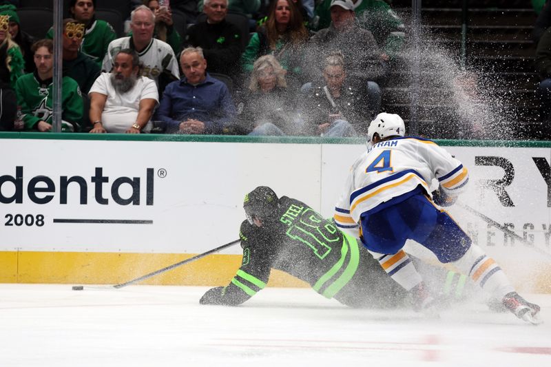 Dec 31, 2024; Dallas, Texas, USA; Dallas Stars center Sam Steel (18) falls down while defended by Buffalo Sabres defenseman Bowen Byram (4) during the third period at American Airlines Center. Mandatory Credit: Tim Heitman-Imagn Images