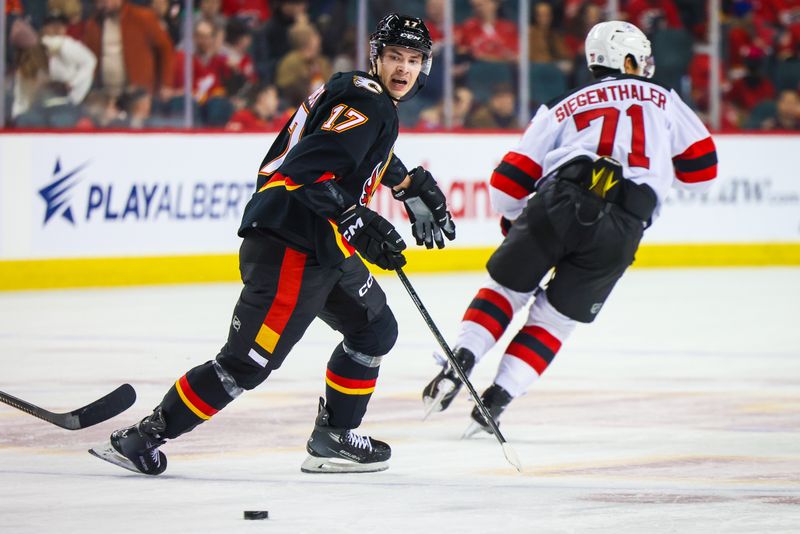 Dec 9, 2023; Calgary, Alberta, CAN; Calgary Flames center Yegor Sharangovich (17) skates against the New Jersey Devils during the first period at Scotiabank Saddledome. Mandatory Credit: Sergei Belski-USA TODAY Sports