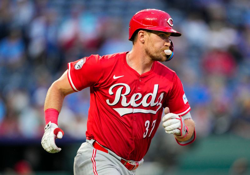 May 28, 2025; Kansas City, Missouri, USA; Cincinnati Reds catcher Tyler Stephenson (37) runs to first base after hitting a single during the sixth inning against the Kansas City Royals at Kauffman Stadium. Mandatory Credit: Jay Biggerstaff-Imagn Images