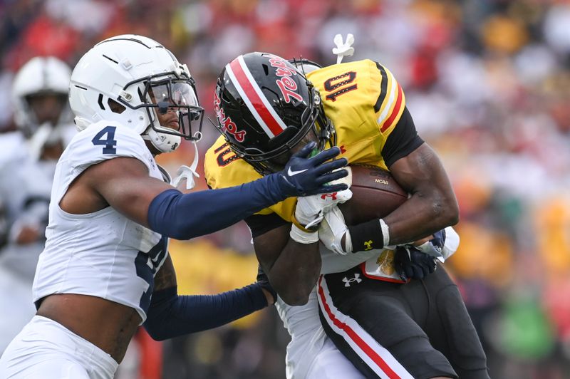 Nov 4, 2023; College Park, Maryland, USA;  Maryland Terrapins wide receiver Tai Felton (10) is tackles by Penn State Nittany Lions cornerback Kalen King (4) and P cornerback Johnny Dixon (3)  during the first half at SECU Stadium. Mandatory Credit: Tommy Gilligan-USA TODAY Sports