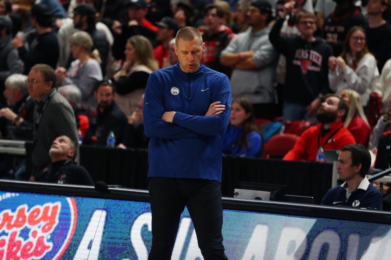 Jan 20, 2024; Lubbock, Texas, USA;  Brigham Young Cougars head coach Mark Pope reacts at the end of a game against the Texas Tech Red Raiders at United Supermarkets Arena. Mandatory Credit: Michael C. Johnson-USA TODAY Sports