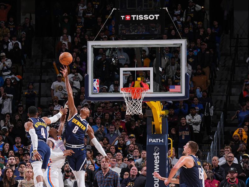 DENVER, CO - NOVEMBER 6: Peyton Watson #8 of the Denver Nuggets makes the game winning block during the game against the Oklahoma City Thunder on November 6, 2024 at Ball Arena in Denver, Colorado. NOTE TO USER: User expressly acknowledges and agrees that, by downloading and/or using this Photograph, user is consenting to the terms and conditions of the Getty Images License Agreement. Mandatory Copyright Notice: Copyright 2024 NBAE (Photo by Garrett Ellwood/NBAE via Getty Images)