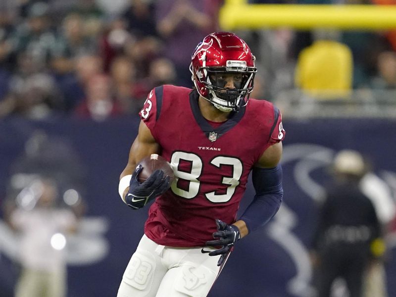 Houston Texans tight end O.J. Howard (83) gains yards after catching a pass during an NFL football game against the Philadelphia Eagles in Houston, Thursday, Nov. 3, 2022. (AP Photo/Tony Gutierrez)