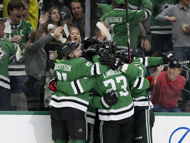 May 15, 2023; Dallas, Texas, USA; Dallas Stars center Roope Hintz (24) and center Joe Pavelski (16) and defenseman Colin Miller (6) and left wing Jason Robertson (21) and defenseman Esa Lindell (23) celebrates after Hintz scores a goal on a breakaway shot against Seattle Kraken goaltender Philipp Grubauer (not pictured) during the second period in game seven of the second round of the 2023 Stanley Cup Playoffs at the American Airlines Center. Mandatory Credit: Jerome Miron-USA TODAY Sports