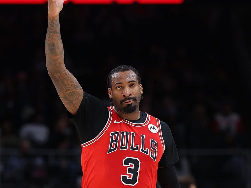 ATLANTA, GEORGIA - FEBRUARY 12:  Andre Drummond #3 of the Chicago Bulls reacts after a three-point basket by Ayo Dosunmu #12 against the Atlanta Hawks during the first quarter at State Farm Arena on February 12, 2024 in Atlanta, Georgia.  NOTE TO USER: User expressly acknowledges and agrees that, by downloading and/or using this photograph, user is consenting to the terms and conditions of the Getty Images License Agreement.  (Photo by Kevin C. Cox/Getty Images)