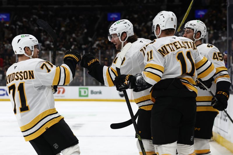 Jan 10, 2026; Boston, Massachusetts, USA; Boston Bruins left wing Viktor Arvidsson (71) congratulates center Pavel Zacha (18) after he scored against the New York Rangers during the first period at TD Garden. Mandatory Credit: Winslow Townson-Imagn Images