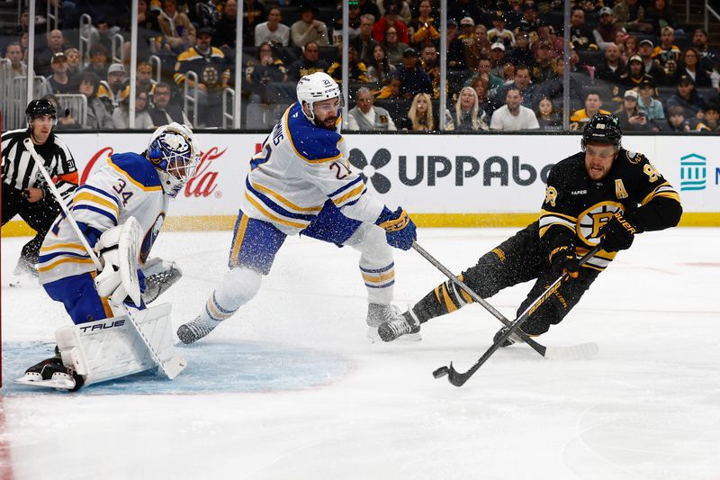 Oct 11, 2025; Boston, Massachusetts, USA; Boston Bruins right wing David Pastrnak (88) gets off a shot on Buffalo Sabres goaltender Alex Lyon (34) as defenseman Conor Timmins (21) defends during the first period at TD Garden. Mandatory Credit: Winslow Townson-Imagn Images