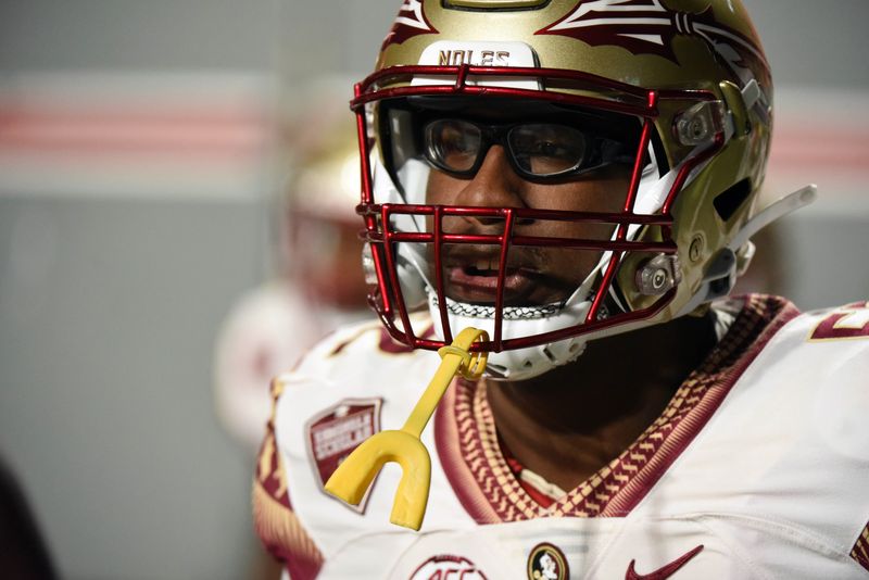 Oct 8, 2022; Raleigh, North Carolina, USA; Florida State Seminoles tackle Robert Scott Jr. (52) warms up prior to a game against the North Carolina State Wolfpack at Carter-Finley Stadium. Mandatory Credit: Rob Kinnan-USA TODAY Sports