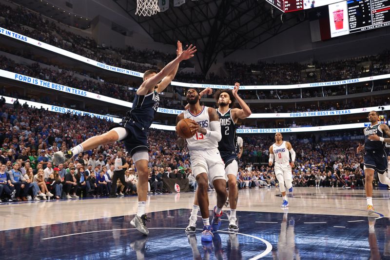 DALLAS, TX - APRIL 28: Paul George #13 of the LA Clippers drives to the basket during the game against the Dallas Mavericks during Round 1 Game 4 of the 2024 NBA Playoffs on April 28, 2024 at the American Airlines Center in Dallas, Texas. NOTE TO USER: User expressly acknowledges and agrees that, by downloading and or using this photograph, User is consenting to the terms and conditions of the Getty Images License Agreement. Mandatory Copyright Notice: Copyright 2024 NBAE (Photo by Tim Heitman/NBAE via Getty Images)