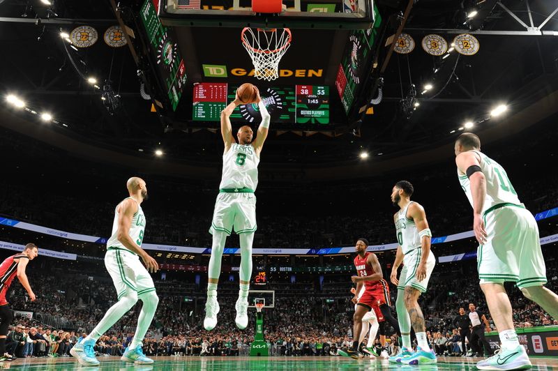 BOSTON, MA - APRIL 21: Kristaps Porzingis #8 of the Boston Celtics grabs a rebound during the game against the Miami Heat during Round 1 Game 1 of the 2024 NBA Playoffs on April 21, 2024 at the TD Garden in Boston, Massachusetts. NOTE TO USER: User expressly acknowledges and agrees that, by downloading and or using this photograph, User is consenting to the terms and conditions of the Getty Images License Agreement. Mandatory Copyright Notice: Copyright 2024 NBAE  (Photo by Brian Babineau/NBAE via Getty Images)