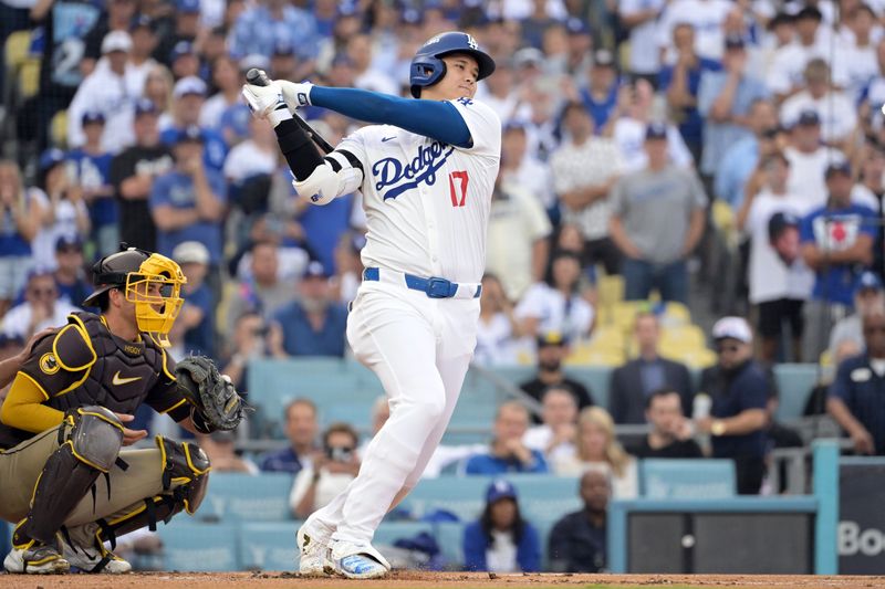 Oct 11, 2024; Los Angeles, California, USA; Los Angeles Dodgers designated hitter Shohei Ohtani (17) strikes out in the first inning against the San Diego Padres during game five of the NLDS for the 2024 MLB Playoffs at Dodger Stadium. Mandatory Credit: Jayne Kamin-Oncea-Imagn Images