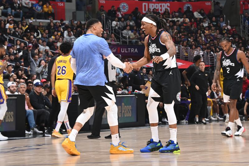 LOS ANGELES, CA - FEBRUARY 28: Terance Mann #14 high fives Russell Westbrook #0 of the LA Clippers during the game against the Los Angeles Lakers on February 28, 2024 at Crypto.Com Arena in Los Angeles, California. NOTE TO USER: User expressly acknowledges and agrees that, by downloading and/or using this Photograph, user is consenting to the terms and conditions of the Getty Images License Agreement. Mandatory Copyright Notice: Copyright 2024 NBAE (Photo by Andrew D. Bernstein/NBAE via Getty Images)